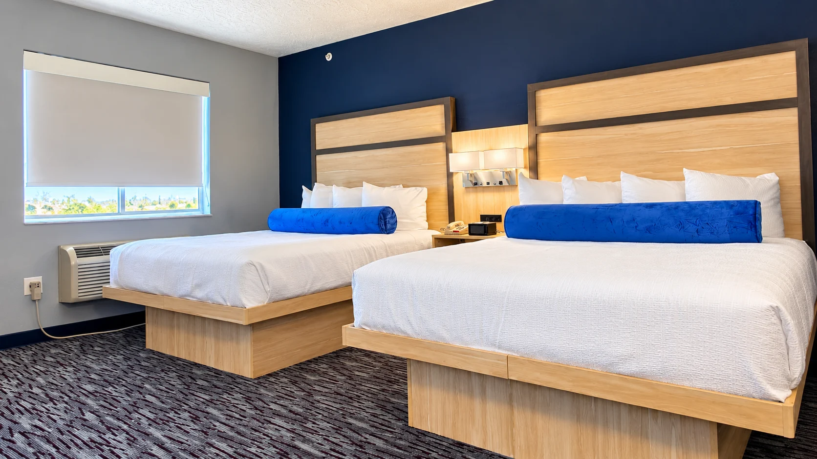 Two queen beds with a window and through-wall heating and cooling unit — Best Western Vernal Inn, Vernal Utah