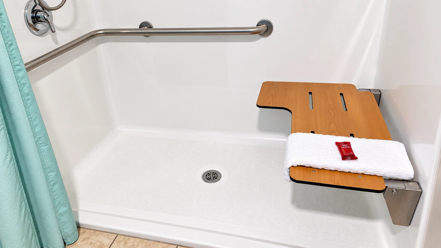 Roll-in shower with grab bar and fold-down seat — accessible room, Best Western Vernal Inn, Vernal Utah