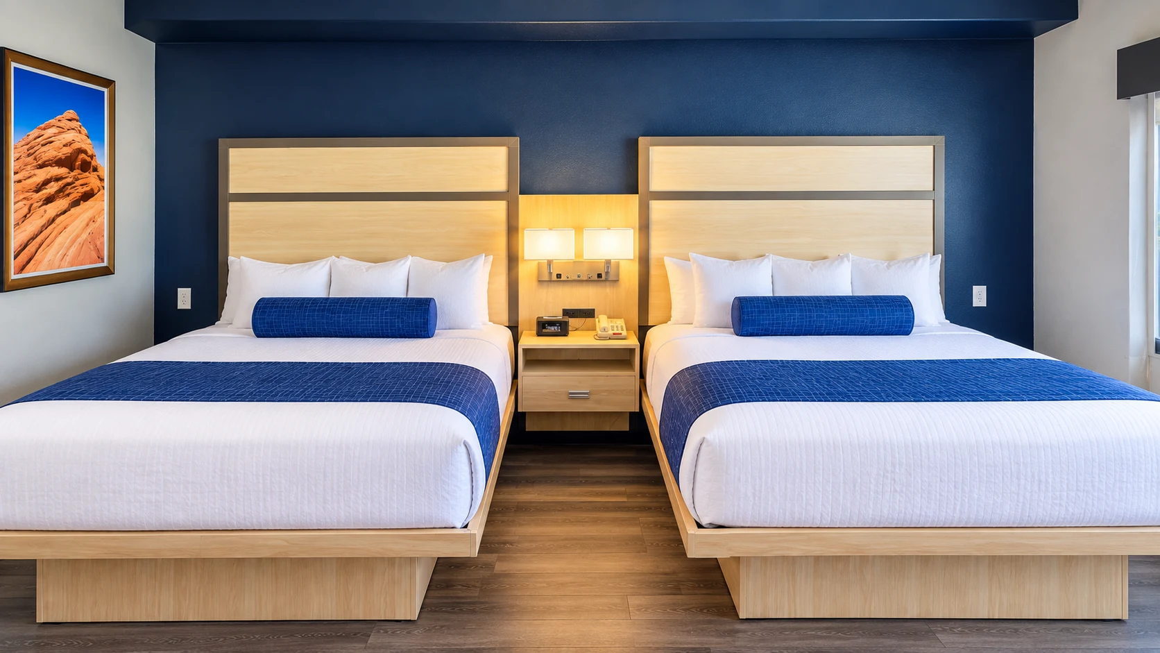 Two queen beds on wood-style plank flooring in a pet-friendly room — Best Western Vernal Inn, Vernal Utah