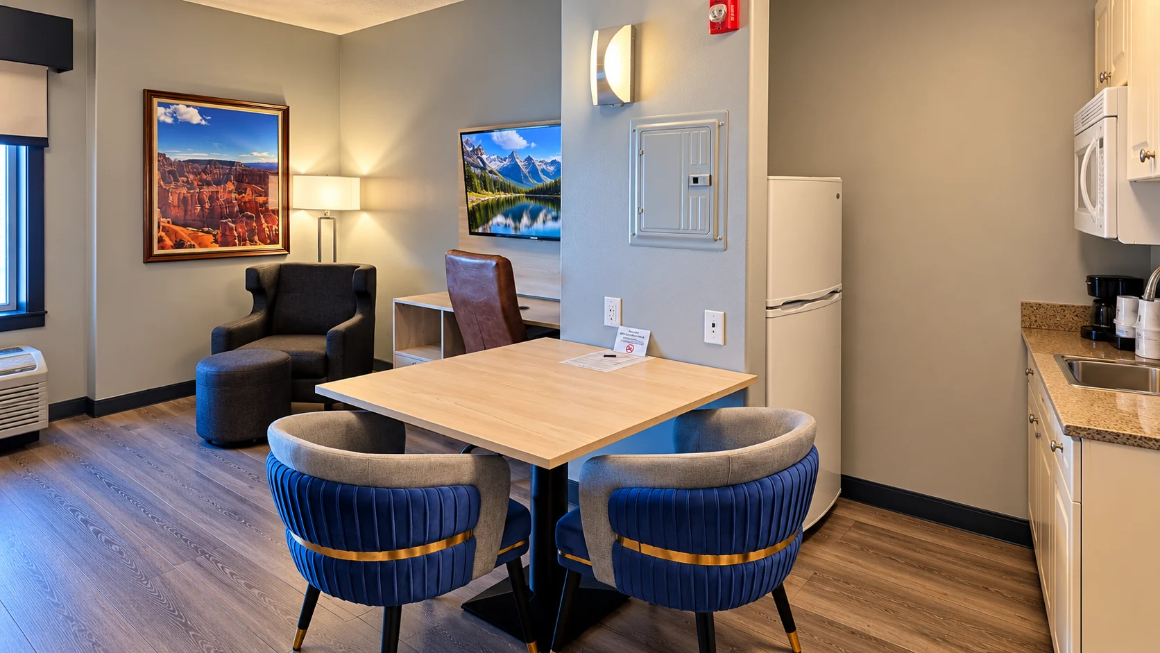 Dining table, refrigerator and seating area in a pet-friendly room — Best Western Vernal Inn, Vernal Utah